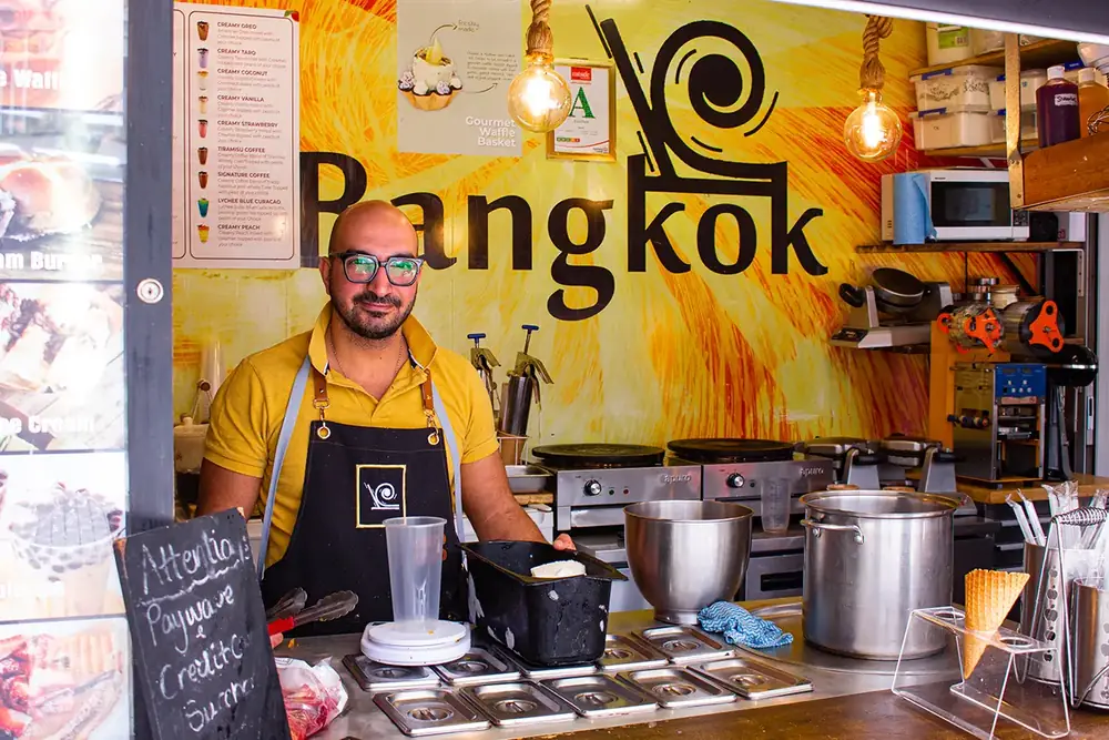 Owner of Bangkok rolled Ice-cream standing in shop