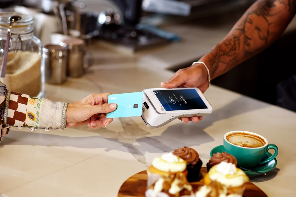 Coffee merchant receiving contactless payment on A920 Terminal