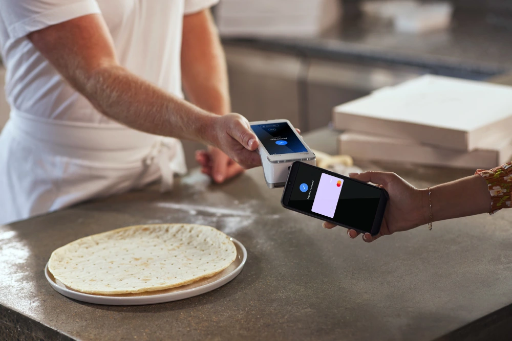 Pizza merchant receiving visa contactless payment success